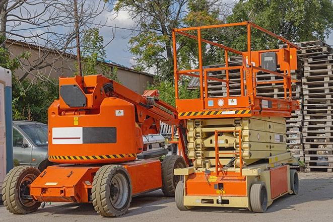 warehouse forklift in action with neatly arranged pallets in Boswell